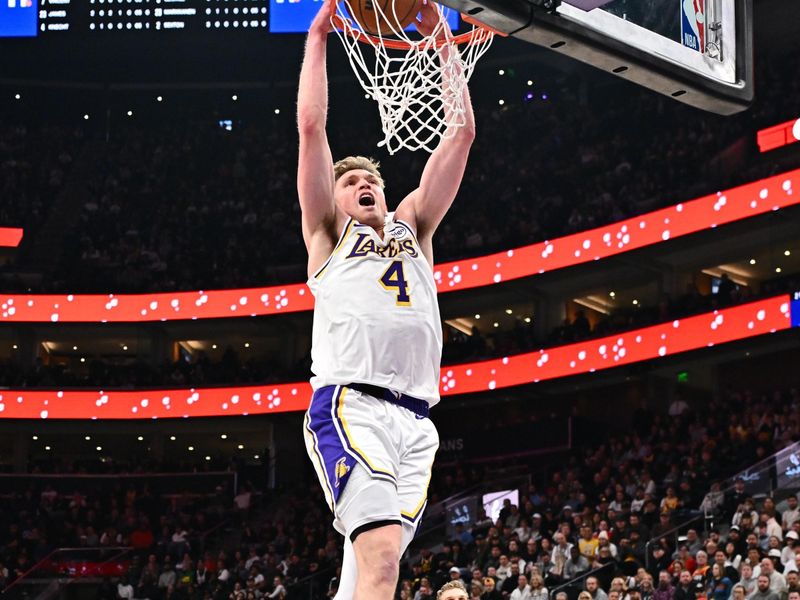 SALT LAKE CITY, UT - DECEMBER 1: Dalton Knecht #4 of the Los Angeles Lakers dunks the ball during the game against the Utah Jazz on December 1, 2024 at Delta Center in Salt Lake City, Utah. NOTE TO USER: User expressly acknowledges and agrees that, by downloading and or using this Photograph, User is consenting to the terms and conditions of the Getty Images License Agreement. Mandatory Copyright Notice: Copyright 2024 NBAE (Photo by Jamie Sabau/NBAE via Getty Images)