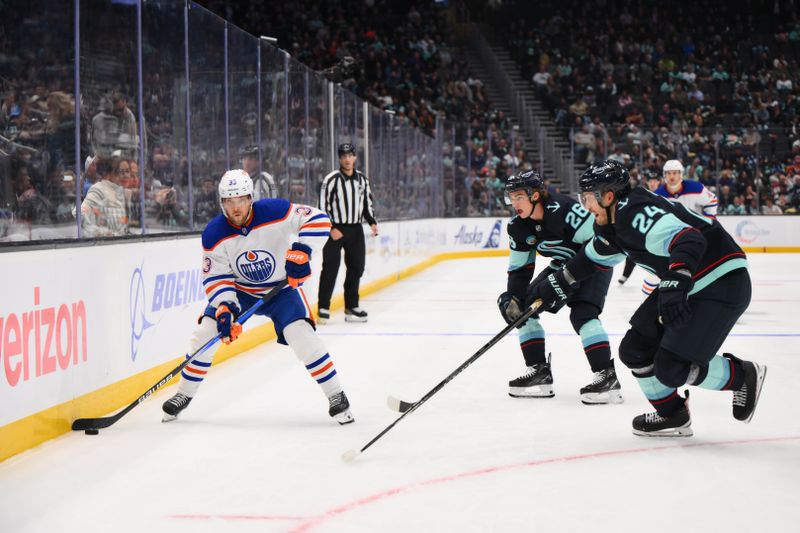 Oct 2, 2024; Seattle, Washington, USA; Edmonton Oilers left wing Viktor Arvidsson (33) advances the puck while defended by Seattle Kraken center Ryan Winterton (26) and defenseman Jamie Oleksiak (24)  during the second period at Climate Pledge Arena. Mandatory Credit: Steven Bisig-Imagn Images