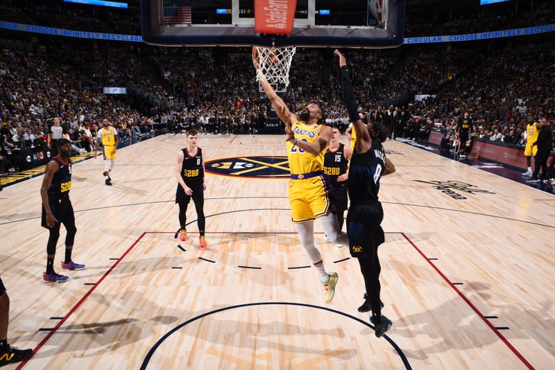 DENVER, CO - APRRIL 22: Spencer Dinwiddie #26 of the Los Angeles Lakers drives to the basket during the game against the Denver Nuggets during Round 1 Game 2 of the 2024 NBA Playoffs on April 22, 2024 at the Ball Arena in Denver, Colorado. NOTE TO USER: User expressly acknowledges and agrees that, by downloading and/or using this Photograph, user is consenting to the terms and conditions of the Getty Images License Agreement. Mandatory Copyright Notice: Copyright 2024 NBAE (Photo by Garrett Ellwood/NBAE via Getty Images)