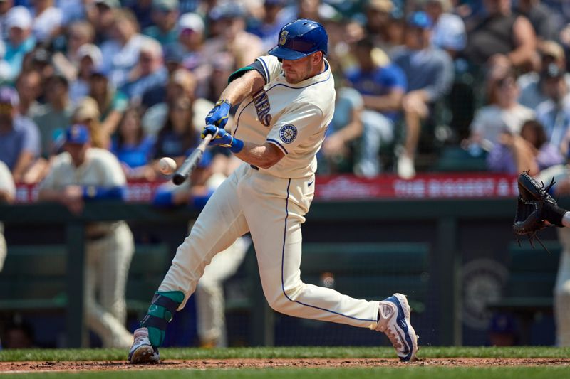 Jul 21, 2024; Seattle, Washington, USA; Seattle Mariners first baseman Luke Raley (20) hits a three-run home run against the Houston Astros during the sixth inning at T-Mobile Park. Mandatory Credit: John Froschauer-USA TODAY Sports