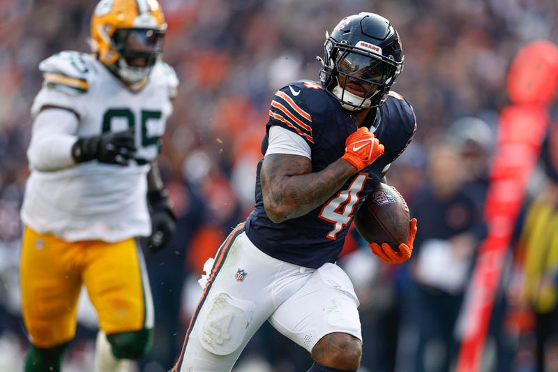 Chicago Bears running back D'Andre Swift (4) runs to score a touchdown against the Green Bay Packers during the second half of an NFL football game, Sunday, Nov. 17, 2024, in Chicago. (AP Photo/Kamil Krzaczynski)