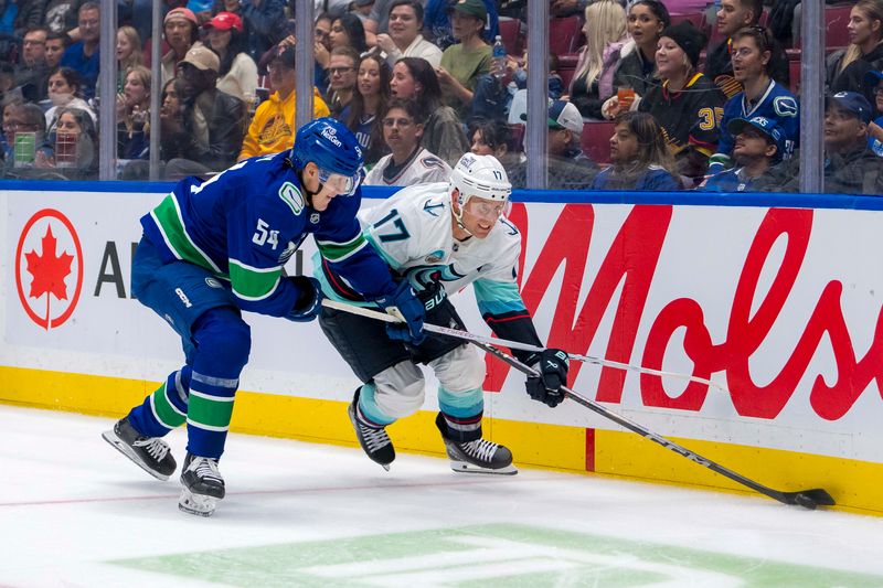 Sep 24, 2024; Vancouver, British Columbia, CAN; Vancouver Canucks forward Aatu Raty (54) stick checks Seattle Kraken forward Jaden Schwartz (17) during the second period at Rogers Arena. Mandatory Credit: Bob Frid-Imagn Images