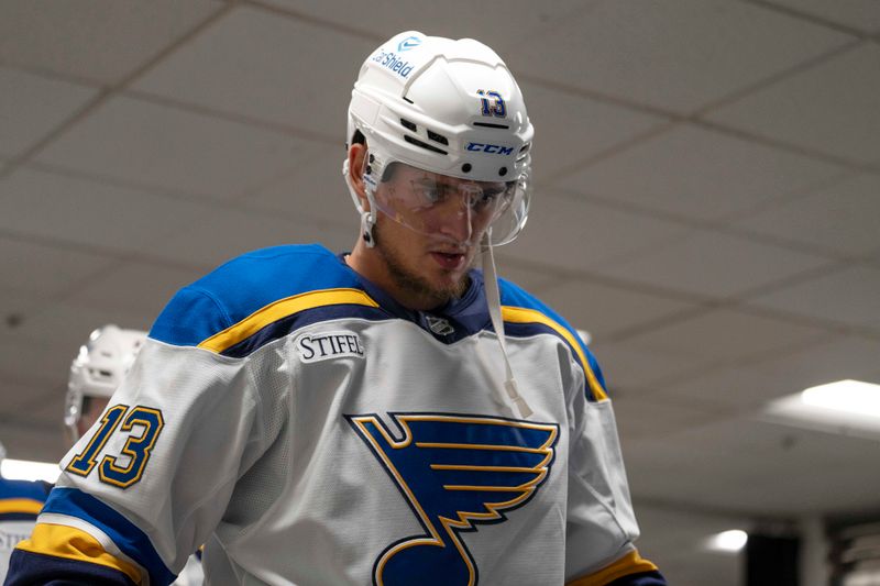 Oct 10, 2024; San Jose, California, USA; St. Louis Blues right wing Alexey Toropchenko (13) walks out onto the ice before the start of warm ups against the San Jose Sharks at SAP Center at San Jose. Mandatory Credit: Stan Szeto-Imagn Images