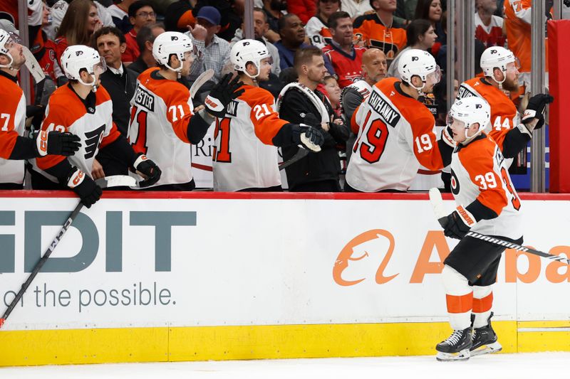 Oct 23, 2024; Washington, District of Columbia, USA; Philadelphia Flyers right wing Matvei Michkov (39) celebrates with teammates after scoring a goal against the Washington Capitals in the third period at Capital One Arena. Mandatory Credit: Geoff Burke-Imagn Images