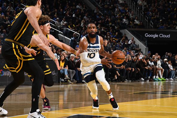 SAN FRANCISCO, CA - NOVEMBER 14: Mike Conley #10 of the Minnesota Timberwolves drives to the basket during the game against the Golden State Warriors during the In-Season Tournament on November 14, 2023 at Chase Center in San Francisco, California. NOTE TO USER: User expressly acknowledges and agrees that, by downloading and or using this photograph, user is consenting to the terms and conditions of Getty Images License Agreement. Mandatory Copyright Notice: Copyright 2023 NBAE (Photo by Noah Graham/NBAE via Getty Images)