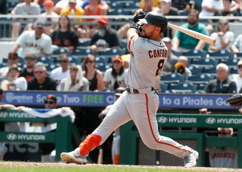 Jul 16, 2023; Pittsburgh, Pennsylvania, USA;  San Francisco Giants right fielder Michael Conforto (8) hits a two run double against the Pittsburgh Pirates during the tenth inning at PNC Park. Mandatory Credit: Charles LeClaire-USA TODAY Sports