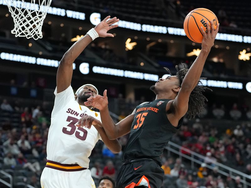 Mar 8, 2023; Las Vegas, NV, USA; Oregon State Beavers forward Glenn Taylor Jr. (35) shoots against Arizona State Sun Devils guard Devan Cambridge (35) during the second half at T-Mobile Arena. Mandatory Credit: Stephen R. Sylvanie-USA TODAY Sports