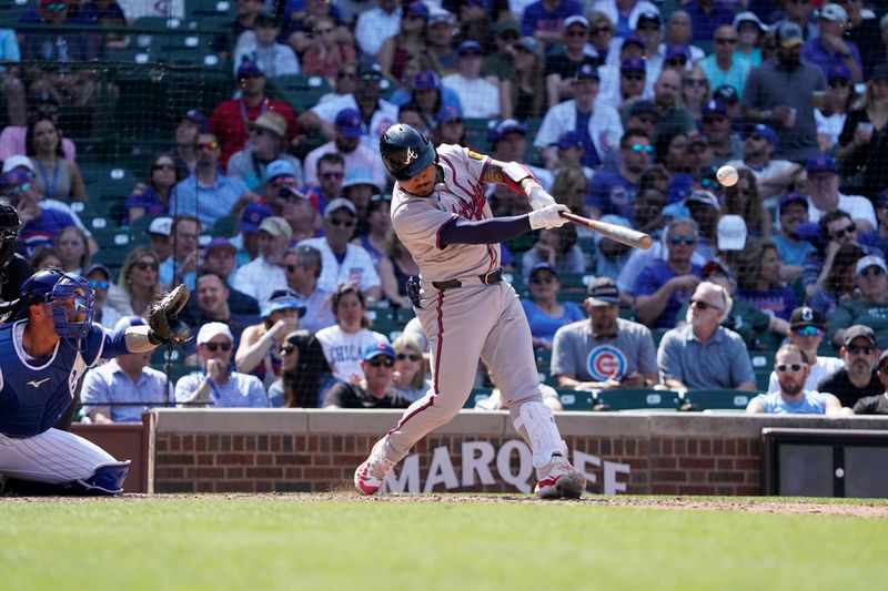 May 23, 2024; Chicago, Illinois, USA; Atlanta Braves catcher Chadwick Tromp (45) hits a single against the Chicago Cubs during the eighth inning at Wrigley Field. Mandatory Credit: David Banks-USA TODAY Sports