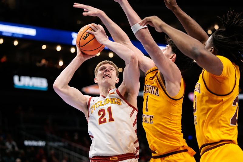 Mar 11, 2026; Kansas City, MO, USA; Iowa State Cyclones forward Dominykas Pleta (21) shoots the ball around Arizona State Sun Devils forward Santiago Trouet (1) during the first half at T-Mobile Center. Mandatory Credit: William Purnell-Imagn Images