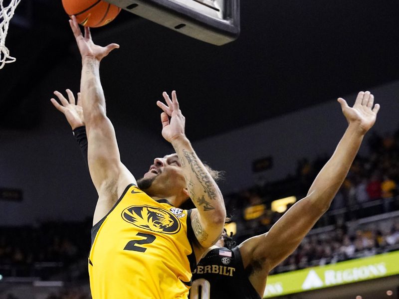 Jan 7, 2023; Columbia, Missouri, USA; Vanderbilt Commodores guard Noah Shelby (2) shoots a layup as Vanderbilt Commodores guard Tyrin Lawrence (0) defends during the first half at Mizzou Arena. Mandatory Credit: Denny Medley-USA TODAY Sports