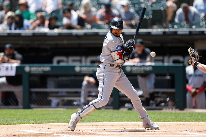 Jun 10, 2023; Chicago, Illinois, USA; Miami Marlins second baseman Luis Arraez (3) is hit by a pitch from Chicago White Sox starting pitcher Michael Kopech (not pictured) during the first inning at Guaranteed Rate Field. Mandatory Credit: Kamil Krzaczynski-USA TODAY Sports