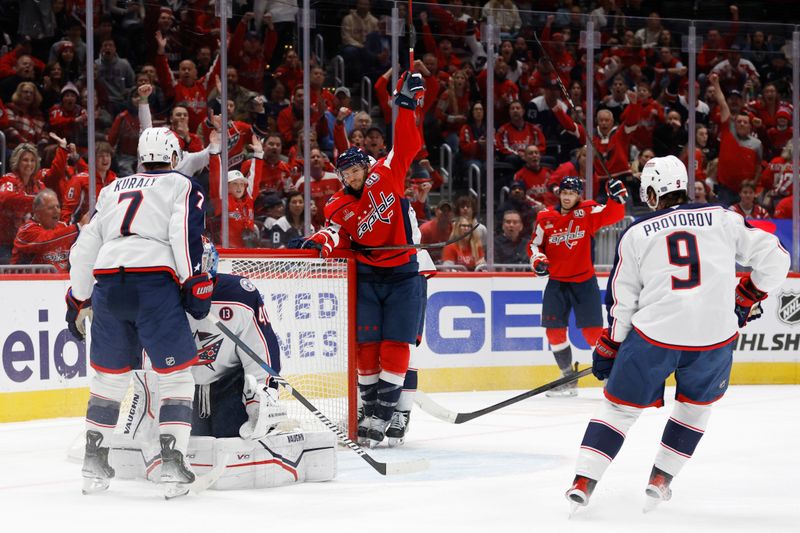 Nov 2, 2024; Washington, District of Columbia, USA; Washington Capitals center Nic Dowd (26) celebrates after scoring a goal on Columbus Blue Jackets goaltender Daniil Tarasov (40) in the first period at Capital One Arena. Mandatory Credit: Geoff Burke-Imagn Images