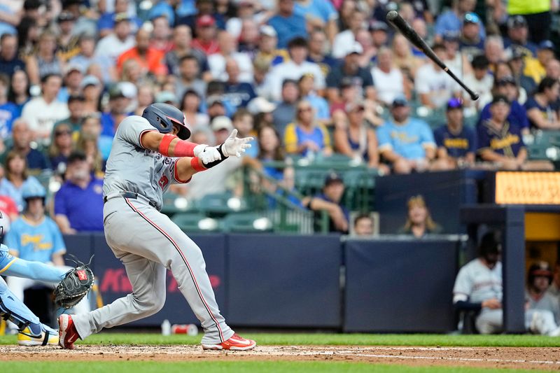 Jul 12, 2024; Milwaukee, Wisconsin, USA;  Washington Nationals catcher Keibert Ruiz (20) loses his bat during a swing during the fourth inning against the Milwaukee Brewers at American Family Field. Mandatory Credit: Jeff Hanisch-USA TODAY Sports