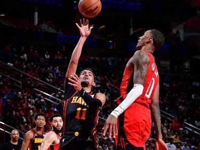 HOUSTON, TX - DECEMBER 20:   Trae Young #11 of the Atlanta Hawks drives to the basket during the game against the Houston Rockets on December 20, 2023 at the Toyota Center in Houston, Texas. NOTE TO USER: User expressly acknowledges and agrees that, by downloading and or using this photograph, User is consenting to the terms and conditions of the Getty Images License Agreement. Mandatory Copyright Notice: Copyright 2023 NBAE (Photo by Logan Riely/NBAE via Getty Images)