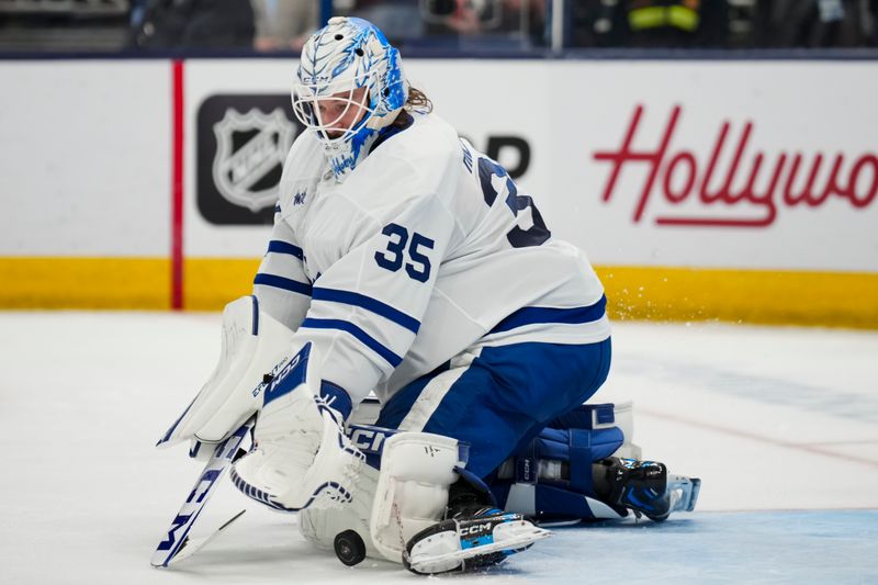 Oct 22, 2024; Columbus, Ohio, USA; Toronto Maple Leafs goaltender Dennis Hildeby (35) attempts a save against the Columbus Blue Jackets during the second period at Nationwide Arena. Mandatory Credit: Aaron Doster-Imagn Images