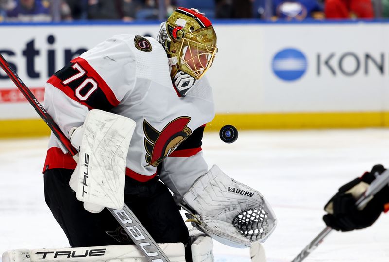 Jan 11, 2024; Buffalo, New York, USA;  Ottawa Senators goaltender Joonas Korpisalo (70) makes a save during the third period against the Buffalo Sabres at KeyBank Center. Mandatory Credit: Timothy T. Ludwig-USA TODAY Sports