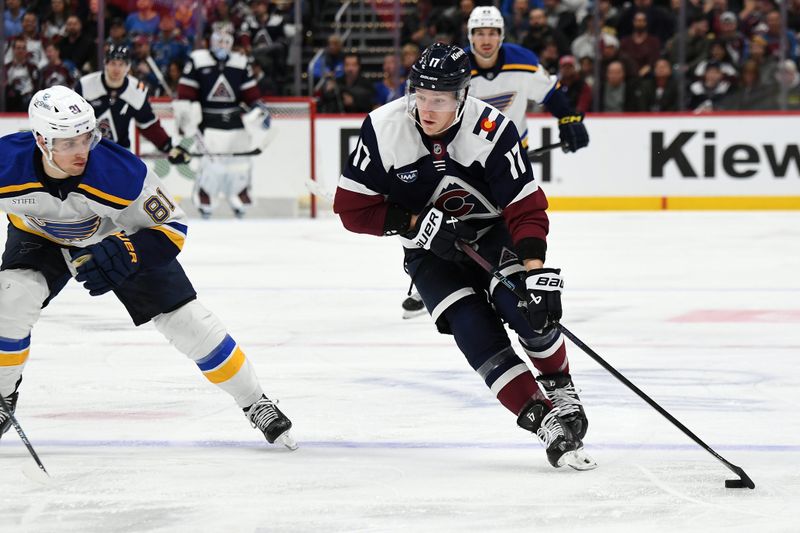 Jan 31, 2025; Denver, Colorado, USA; Colorado Avalanche center Parker Kelly (17) skates the puck into the offensive zone during the second period against the St. Louis Blues at Ball Arena. Mandatory Credit: Christopher Hanewinckel-Imagn Images