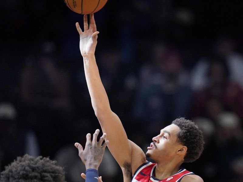 WASHINGTON, DC - JANUARY 24: Jordan Poole #13 of the Washington Wizards shoots against Jaden McDaniels #3 of the Minnesota Timberwolves during the first half at Capital One Arena on January 24, 2024 in Washington, DC. NOTE TO USER: User expressly acknowledges and agrees that, by downloading and or using this photograph, User is consenting to the terms and conditions of the Getty Images License Agreement. (Photo by Jess Rapfogel/Getty Images)