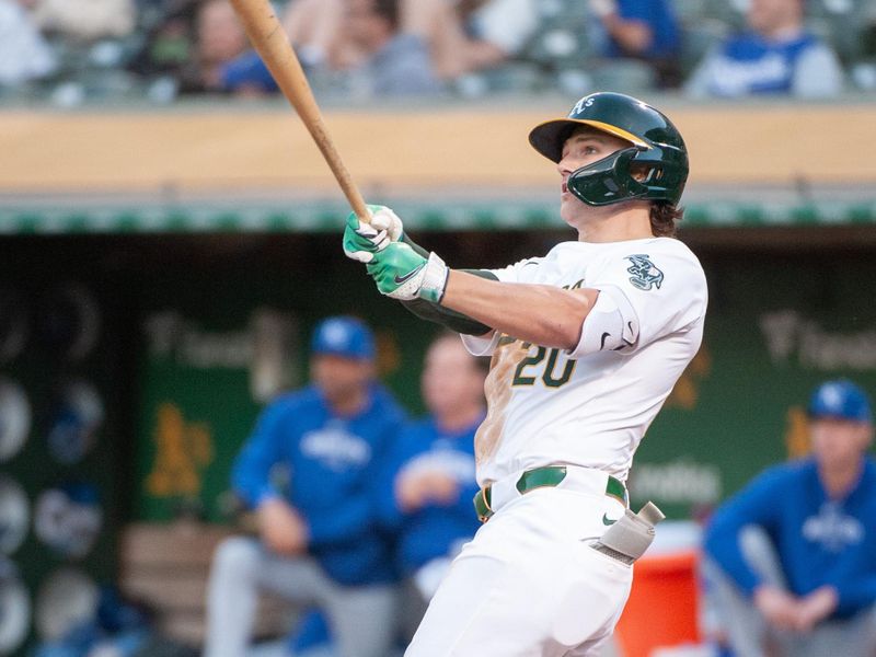 Jun 18, 2024; Oakland, California, USA; Oakland Athletics second base Zack Gelof (20) hits a home run against the Kansas City Royals during the fourth inning at Oakland-Alameda County Coliseum. Mandatory Credit: Ed Szczepanski-USA TODAY Sports