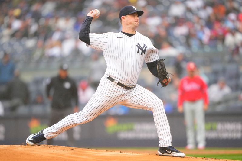 Apr 5, 2023; Bronx, New York, USA;  New York Yankees pitcher Gerrit Cole (45) delivers a pitch against the Philadelphia Phillies during the first inning at Yankee Stadium. Mandatory Credit: Gregory Fisher-USA TODAY Sports