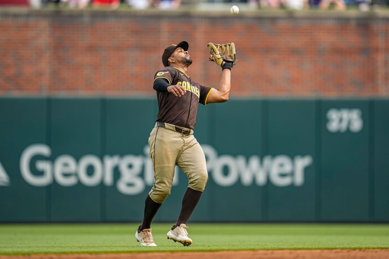 May 25, 2025; Cumberland, Georgia, USA; San Diego Padres shortstop Xander Bogaerts (2) catches a pop up hit by Atlanta Braves first baseman Matt Olson (28) (not shown) during the sixth inning at Truist Park. Mandatory Credit: Dale Zanine-Imagn Images