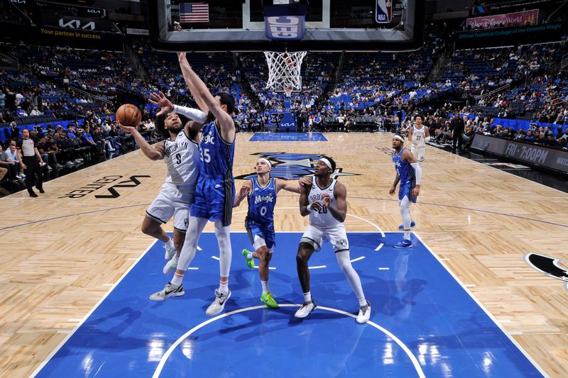 ORLANDO, FL - MARCH 13: Trendon Watford #9 of the Brooklyn Nets drives to the basket during the game against the Orlando Magic on March 13, 2024 at the Kia Center in Orlando, Florida. NOTE TO USER: User expressly acknowledges and agrees that, by downloading and or using this photograph, User is consenting to the terms and conditions of the Getty Images License Agreement. Mandatory Copyright Notice: Copyright 2024 NBAE (Photo by Fernando Medina/NBAE via Getty Images)