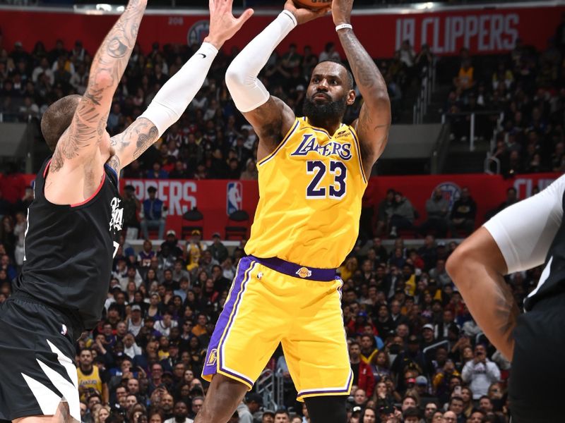 LOS ANGELES, CA - FEBRUARY 28: LeBron James #23 of the Los Angeles Lakers shoots the ball during the game against the LA Clippers on February 28, 2024 at Crypto.Com Arena in Los Angeles, California. NOTE TO USER: User expressly acknowledges and agrees that, by downloading and/or using this Photograph, user is consenting to the terms and conditions of the Getty Images License Agreement. Mandatory Copyright Notice: Copyright 2024 NBAE (Photo by Andrew D. Bernstein/NBAE via Getty Images)