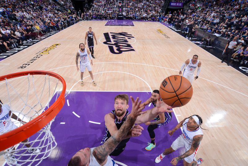 SACRAMENTO, CA - APRIL 2:  Domantas Sabonis #10 of the Sacramento Kings goes to the basket during the game on April 2, 2024 at Golden 1 Center in Sacramento, California. NOTE TO USER: User expressly acknowledges and agrees that, by downloading and or using this Photograph, user is consenting to the terms and conditions of the Getty Images License Agreement. Mandatory Copyright Notice: Copyright 2024 NBAE (Photo by Rocky Widner/NBAE via Getty Images)