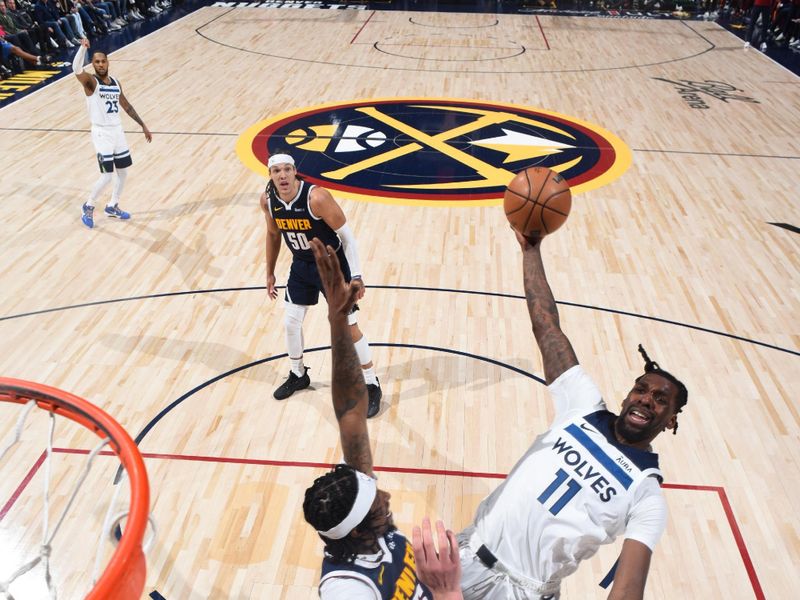 DENVER, CO - APRIL 10: Naz Reid #11 of the Minnesota Timberwolves drives to the basket during the game against the Denver Nuggets on April 10, 2024 at the Ball Arena in Denver, Colorado. NOTE TO USER: User expressly acknowledges and agrees that, by downloading and/or using this Photograph, user is consenting to the terms and conditions of the Getty Images License Agreement. Mandatory Copyright Notice: Copyright 2024 NBAE (Photo by Garrett Ellwood/NBAE via Getty Images)