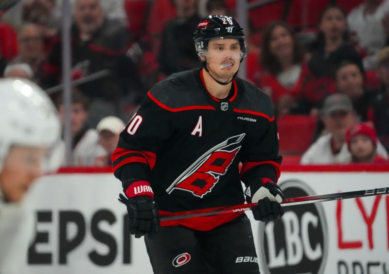 Mar 14, 2024; Raleigh, North Carolina, USA; Carolina Hurricanes center Sebastian Aho (20) skates against the Florida Panthers during the third period at PNC Arena. Mandatory Credit: James Guillory-USA TODAY Sports
