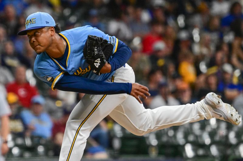 Jun 14, 2024; Milwaukee, Wisconsin, USA; Milwaukee Brewers relief pitcher Elieser Hernandez (25) pitches against the Cincinnati Reds in the eighth inning at American Family Field. Mandatory Credit: Benny Sieu-USA TODAY Sports