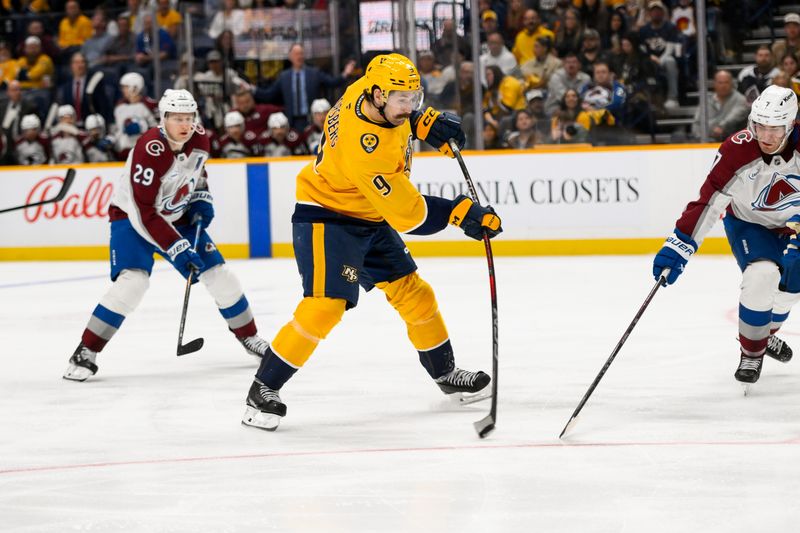 Nov 2, 2024; Nashville, Tennessee, USA;  Nashville Predators left wing Filip Forsberg (9) takes a shot on goal against the Colorado Avalanche during the third period at Bridgestone Arena. Mandatory Credit: Steve Roberts-Imagn Images