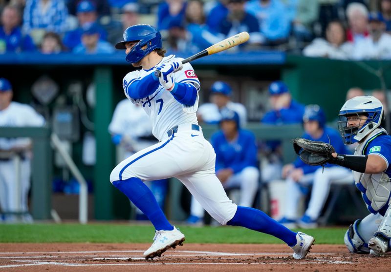 Apr 23, 2024; Kansas City, Missouri, USA; Kansas City Royals shortstop Bobby Witt Jr. (7) hits a single against the Toronto Blue Jays during the first inning at Kauffman Stadium. Mandatory Credit: Jay Biggerstaff-USA TODAY Sports