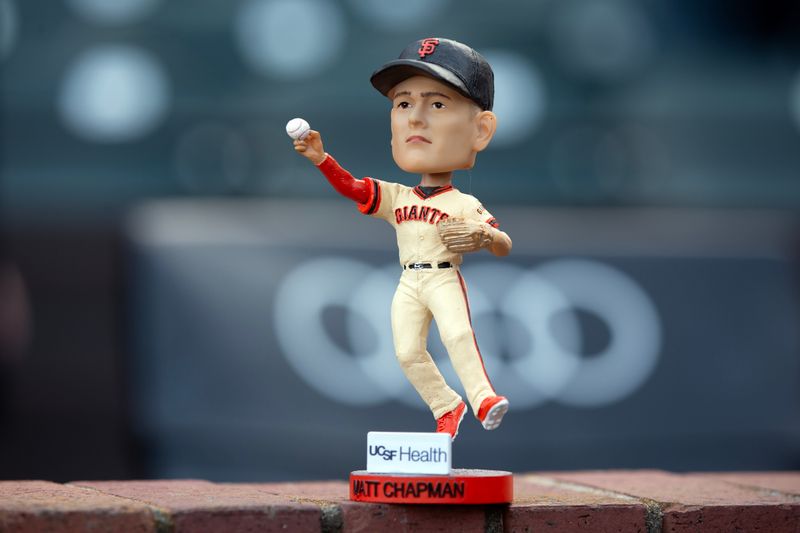 Apr 5, 2025; San Francisco, California, USA; A San Francisco Giants third baseman Matt Chapman (26) bobblehead doll seen before the team takes on Seattle Mariners at Oracle Park. Mandatory Credit: D. Ross Cameron-Imagn Images