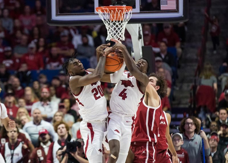 Dec 10, 2022; Tulsa, Oklahoma, USA;  Arkansas Razorbacks forward Kamani Johnson (20) and guard Davonte Davis (4) try to secure rebound past Oklahoma Sooners forward Sam Godwin (10) during the second half at BOK Center. Arkansas won 88-78. Mandatory Credit: Brett Rojo-USA TODAY Sports