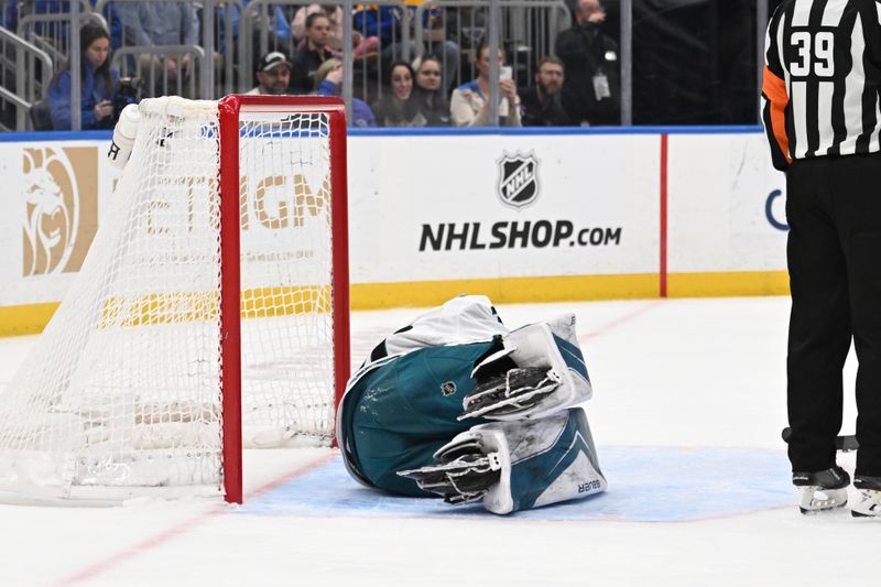 Mar 26, 2026; St. Louis, Missouri, USA; San Jose Sharks goaltender Yaroslav Askarov (30) lays on the ice after being injured against the St. Louis Blues in the second period at Enterprise Center. Mandatory Credit: Joe Puetz-Imagn Images