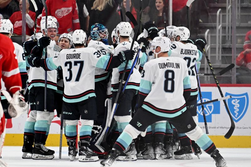 Oct 24, 2023; Detroit, Michigan, USA; The Seattle Kraken celebrate after defeating the Detroit Red Wings in overtime with 4.9 second left in the game at Little Caesars Arena. Mandatory Credit: Lon Horwedel-USA TODAY Sports