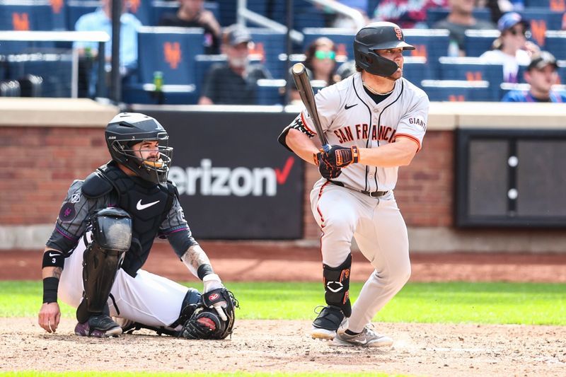 May 25, 2024; New York City, New York, USA;  San Francisco Giants shotstop Brett Wisely (0) hits an RBI single in the tenth inning against the New York Mets at Citi Field. Mandatory Credit: Wendell Cruz-USA TODAY Sports