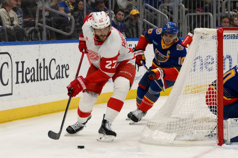 Apr 1, 2025; St. Louis, Missouri, USA; St. Louis Blues center Brayden Schenn (10) pressures Detroit Red Wings center Michael Rasmussen (27) during the first period at Enterprise Center. Mandatory Credit: Jeff Le-Imagn Images