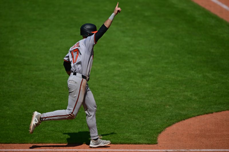 Aug 4, 2024; Cleveland, Ohio, USA; Baltimore Orioles left fielder Colton Cowser (17) celebrates while scoring a run during the sixth inning against the Cleveland Guardians at Progressive Field. Mandatory Credit: David Dermer-USA TODAY Sports