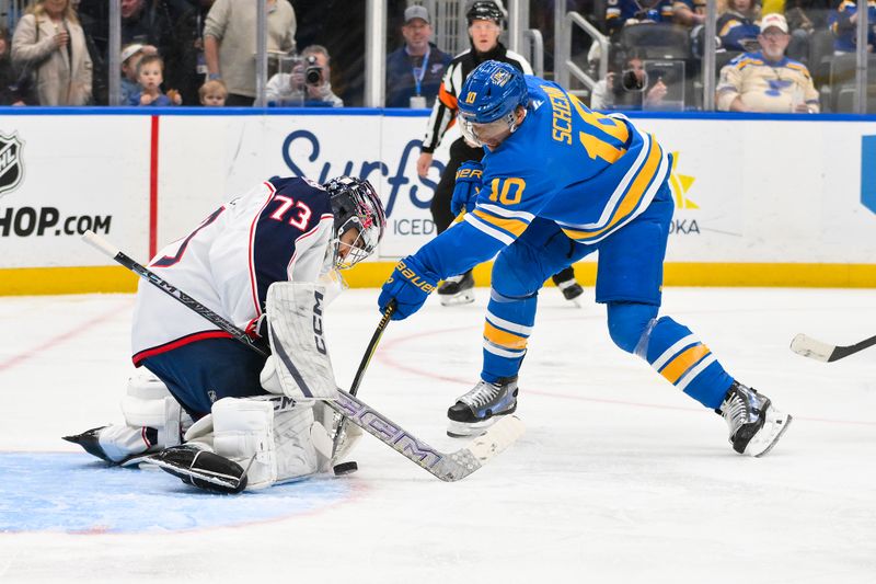 Jan 31, 2026; St. Louis, Missouri, USA; Columbus Blue Jackets goaltender Jet Greaves (73) defends the net against St. Louis Blues center Brayden Schenn (10) during the second period at Enterprise Center. Mandatory Credit: Jeff Curry-Imagn Images