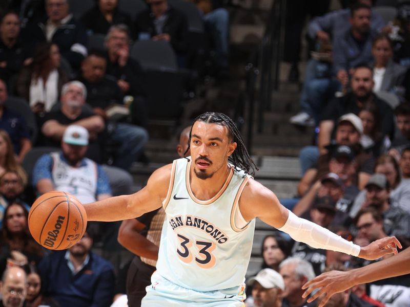 SAN ANTONIO, TX - NOVEMBER 21: Tre Jones #33 of the San Antonio Spurs dribbles the ball during the game against the Utah Jazz on November 21, 2024 at the Frost Bank Center in San Antonio, Texas. NOTE TO USER: User expressly acknowledges and agrees that, by downloading and or using this photograph, user is consenting to the terms and conditions of the Getty Images License Agreement. Mandatory Copyright Notice: Copyright 2024 NBAE (Photos by Nathaniel S. Butler/NBAE via Getty Images)