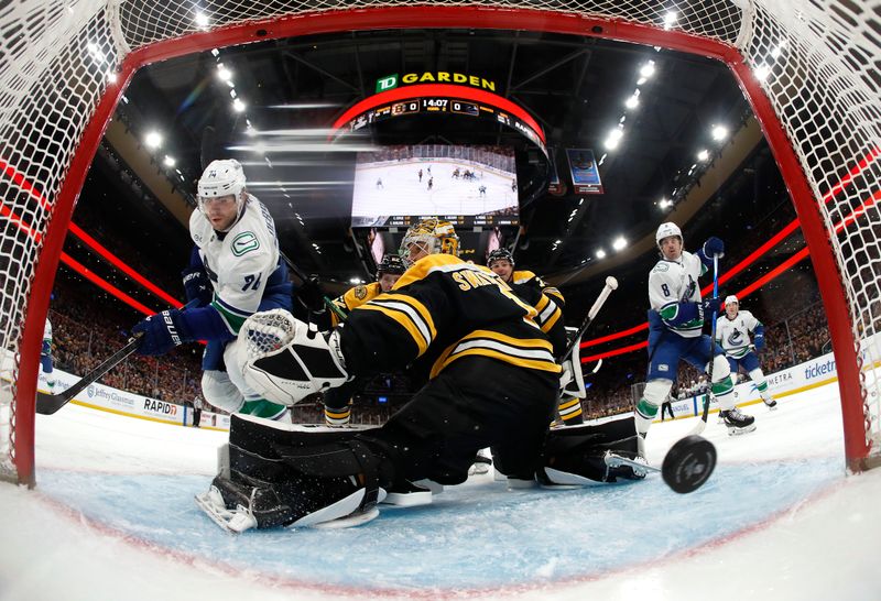 Nov 26, 2024; Boston, Massachusetts, USA; Vancouver Canucks left wing Jake DeBrusk (74) scores on Boston Bruins goaltender Jeremy Swayman (1) during the second period at TD Garden. Mandatory Credit: Winslow Townson-Imagn Images