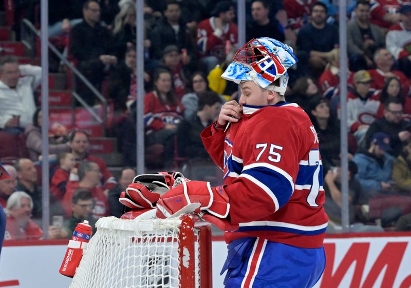 Jan 25, 2025; Montreal, Quebec, CAN; Montreal Canadiens goalie Jakub Dobes (75) reacts during the first period of the game against the New Jersey Devils at the Bell Centre. Mandatory Credit: Eric Bolte-Imagn Images
