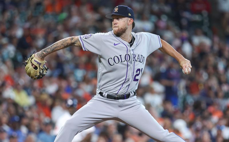 Jul 4, 2023; Houston, Texas, USA; Colorado Rockies starting pitcher Kyle Freeland (21) delivers a pitch during the first inning against the Houston Astros at Minute Maid Park. Mandatory Credit: Troy Taormina-USA TODAY Sports