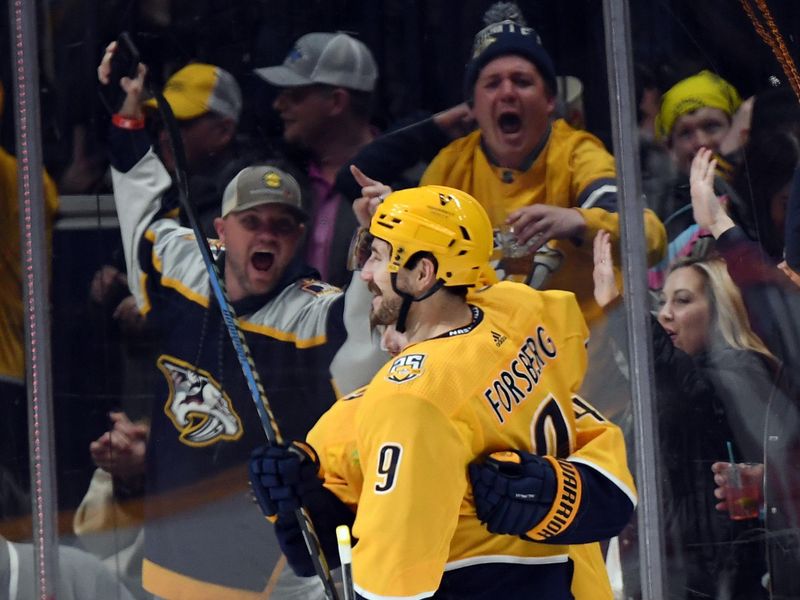 Feb 29, 2024; Nashville, Tennessee, USA; Nashville Predators left wing Filip Forsberg (9) celebrates after a goal during the second period against the Minnesota Wild at Bridgestone Arena. Mandatory Credit: Christopher Hanewinckel-USA TODAY Sports