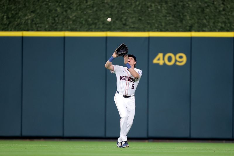 Jun 2, 2024; Houston, Texas, USA; Houston Astros center fielder Jake Meyers (6) catches a fly ball for an out against the Minnesota Twins during the first inning at Minute Maid Park. Mandatory Credit: Erik Williams-USA TODAY Sports