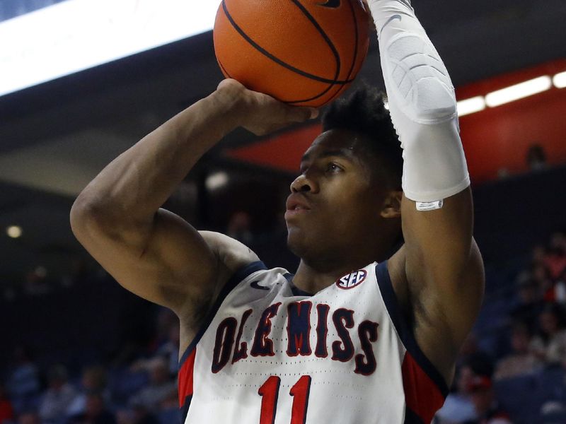 Jan 14, 2023; Oxford, Mississippi, USA; Mississippi Rebels guard Matthew Murrell (11) shoots for three during the second half against the Georgia Bulldogs at The Sandy and John Black Pavilion at Ole Miss. Mandatory Credit: Petre Thomas-USA TODAY Sports