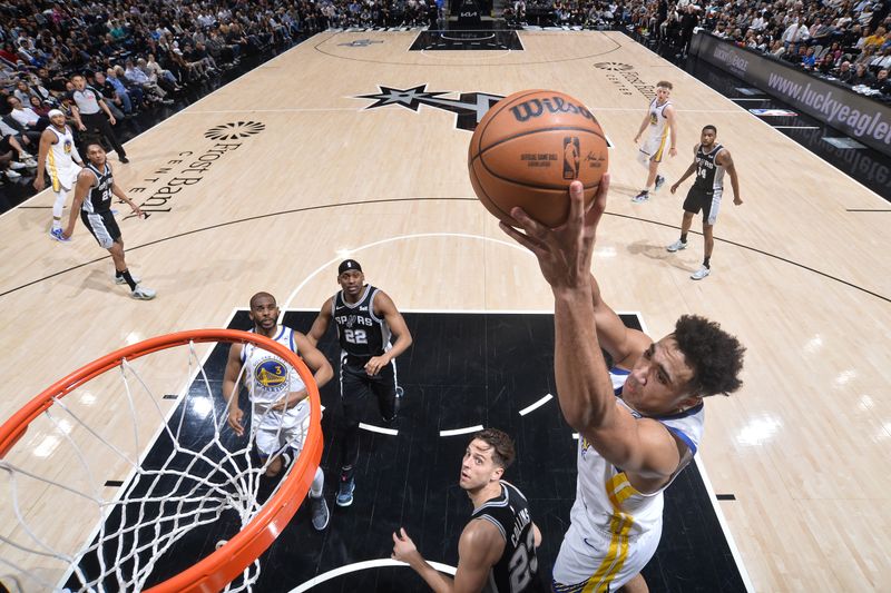 SAN ANTONIO, TX - MARCH 11:  Trayce Jackson-Davis #32 of the Golden State Warriors grabs a rebound during the game against the San Antonio Spurs on March 11, 2024 at the Frost Bank Center in San Antonio, Texas. NOTE TO USER: User expressly acknowledges and agrees that, by downloading and or using this photograph, user is consenting to the terms and conditions of the Getty Images License Agreement. Mandatory Copyright Notice: Copyright 2024 NBAE (Photos by Michael Gonzales/NBAE via Getty Images)