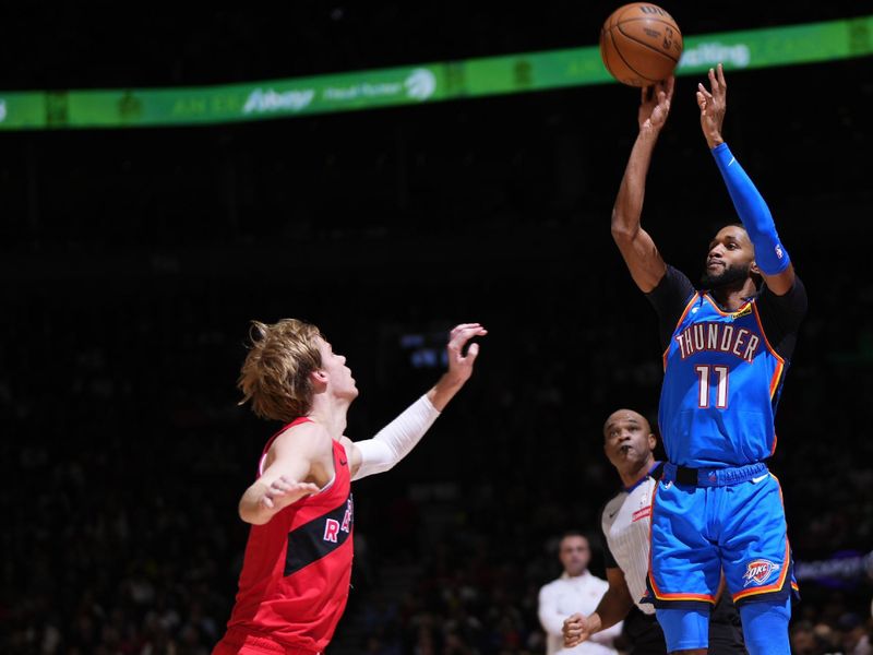 TORONTO, CANADA - DECEMBER 05:  Isaiah Joe #11 of the Oklahoma City Thunder shoots the ball during the game against the Toronto Raptors on December 05, 2024 at the Scotiabank Arena in Toronto, Ontario, Canada.  NOTE TO USER: User expressly acknowledges and agrees that, by downloading and or using this Photograph, user is consenting to the terms and conditions of the Getty Images License Agreement.  Mandatory Copyright Notice: Copyright 2024 NBAE (Photo by Mark Blinch/NBAE via Getty Images)